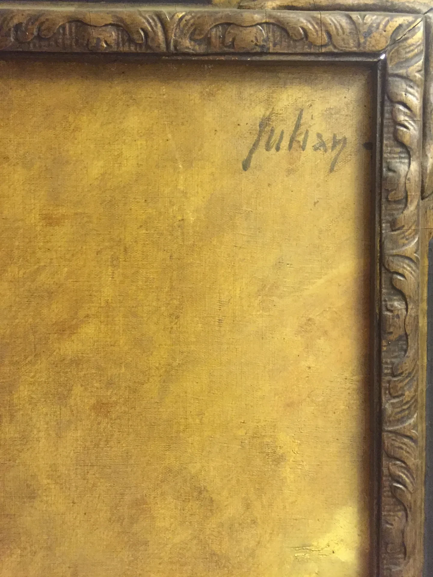 The back of the ornate gold frame for Alice Snell's portrait, with Julian Russell Story's signature visible in the upper right corner